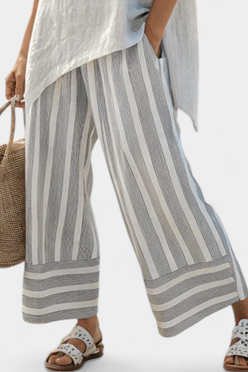 Jane Asymmetric Blouse and Striped Trousers for a Chic Modern Look